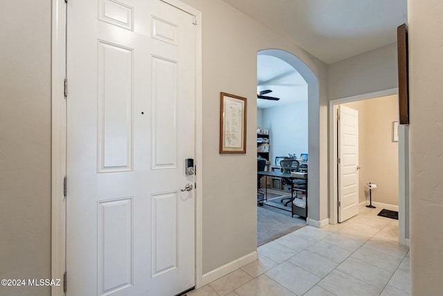 hallway with light tile patterned floors