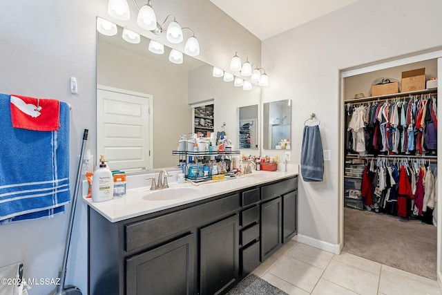 bathroom with tile patterned flooring and vanity