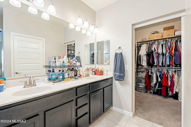 bathroom with tile patterned floors and vanity