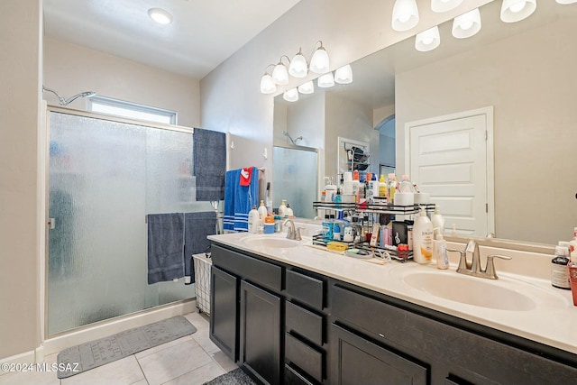 bathroom with vanity, tile patterned floors, and a shower with shower door