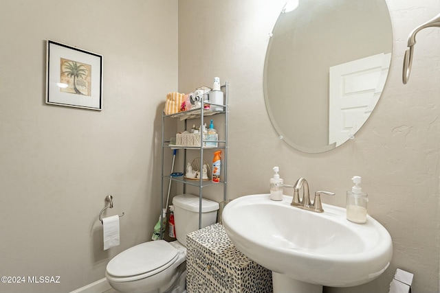 bathroom with toilet and sink