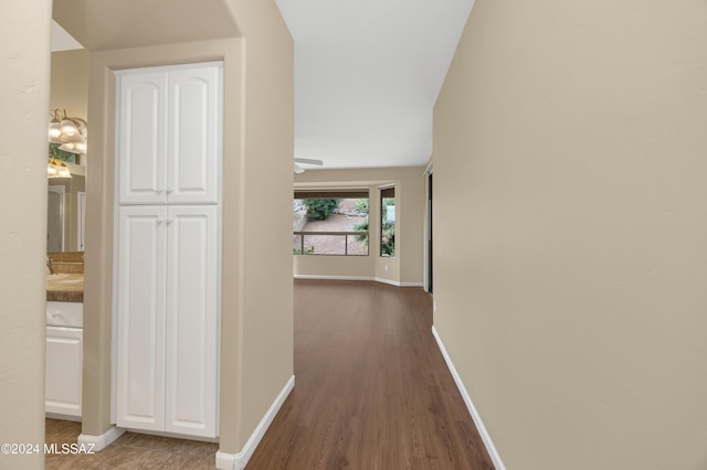 corridor with dark hardwood / wood-style floors