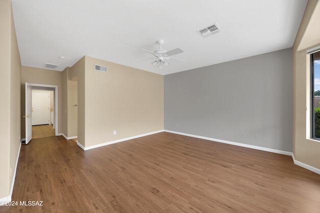 empty room featuring ceiling fan and wood-type flooring