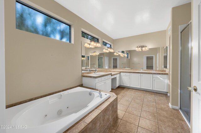 bathroom with vanity, tile patterned floors, and separate shower and tub