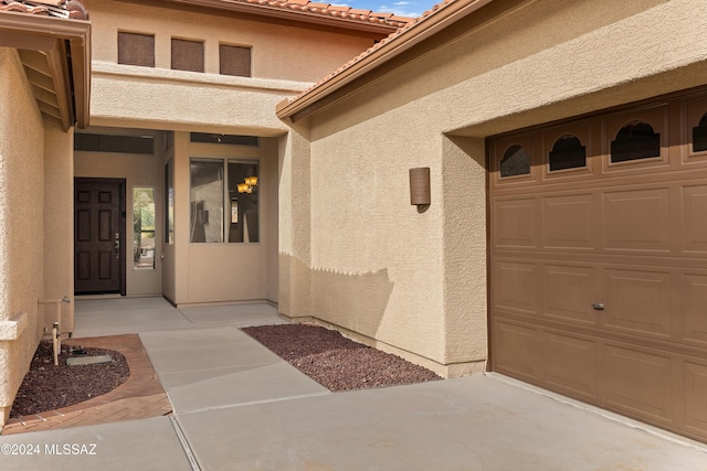 doorway to property featuring a garage