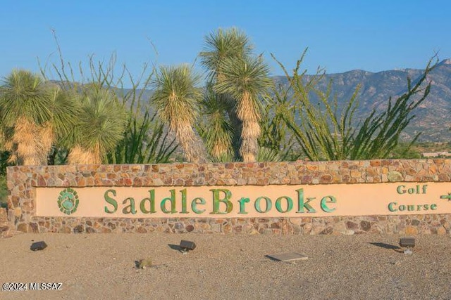 community sign featuring a mountain view