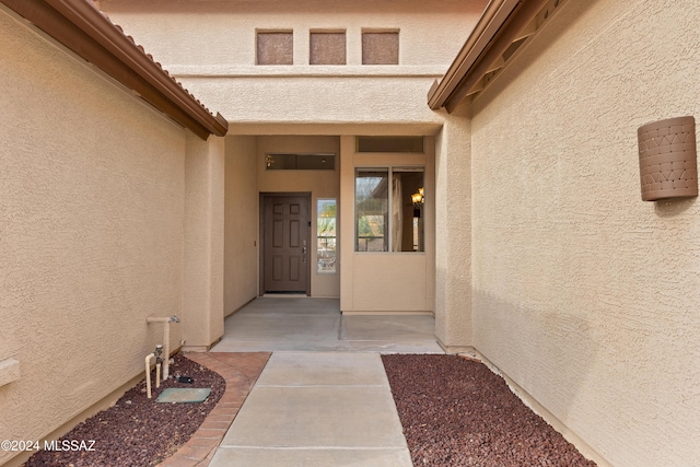 doorway to property with a patio