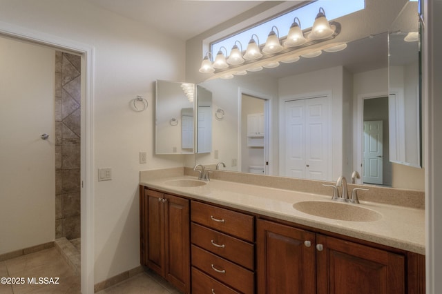 bathroom with vanity, tile patterned floors, and a shower