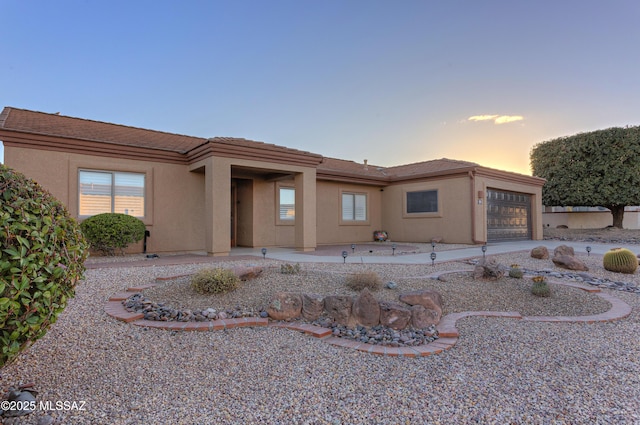 view of front of property featuring a garage