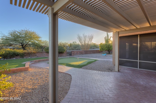 patio terrace at dusk with a pergola