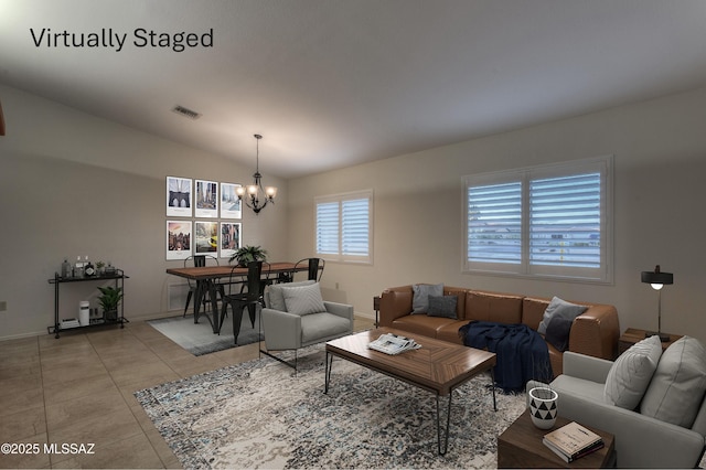 tiled living room featuring lofted ceiling and a chandelier