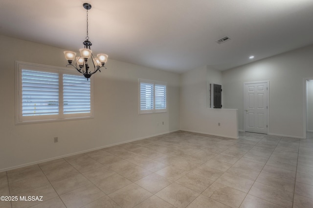 spare room featuring lofted ceiling, light tile patterned floors, and a notable chandelier