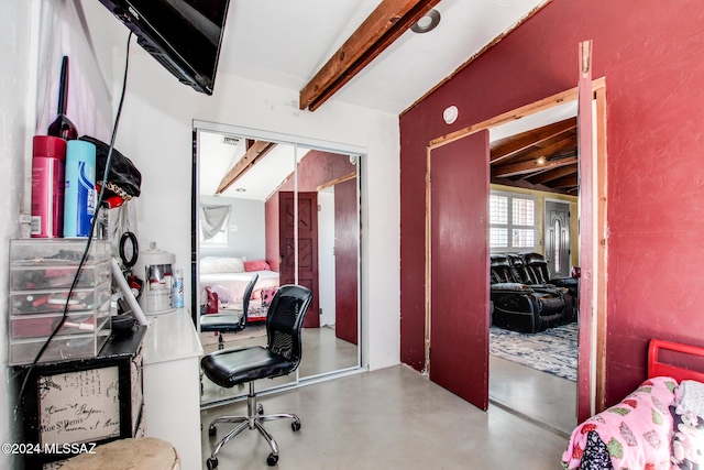 office area with beam ceiling and concrete flooring