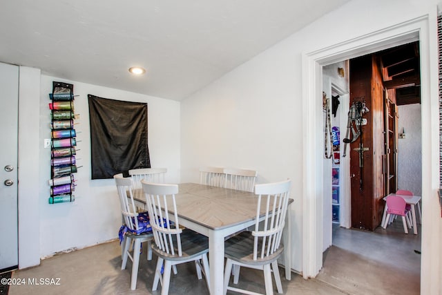 dining space with concrete floors