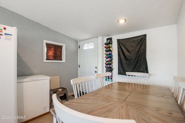 dining room featuring lofted ceiling