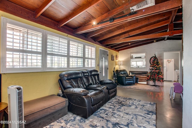 living room featuring lofted ceiling with beams, a healthy amount of sunlight, and concrete floors