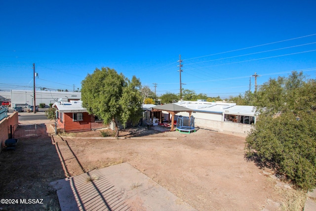 view of front of property with a trampoline