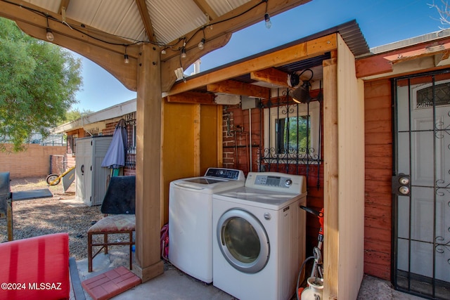 clothes washing area featuring separate washer and dryer