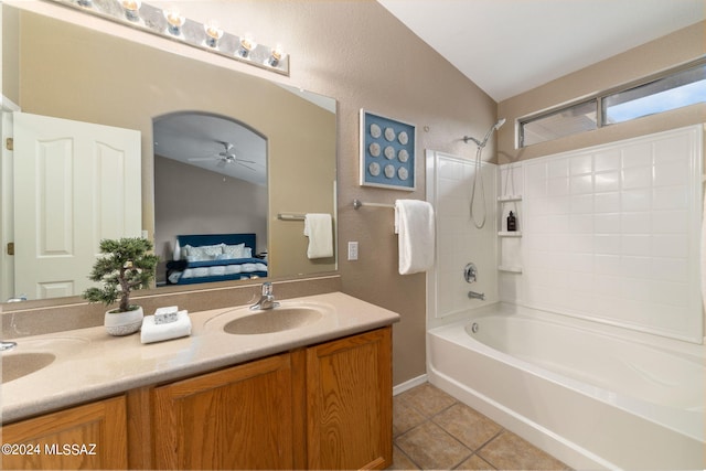 bathroom with vanity, tile patterned floors, shower / washtub combination, vaulted ceiling, and ceiling fan