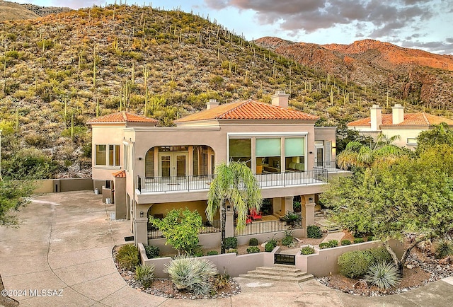 view of front facade with a mountain view and a porch