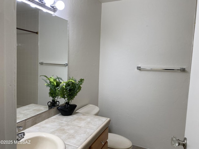 5675 N Camino Esplendora Unit 5228, Tucson, AZ 85718 - bathroom with a textured wall, toilet, and vanity