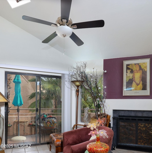 tiled living room with lofted ceiling and a tile fireplace