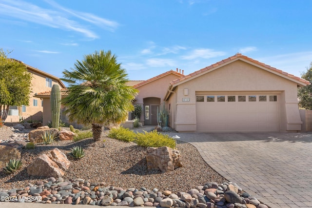 view of front of property with a garage