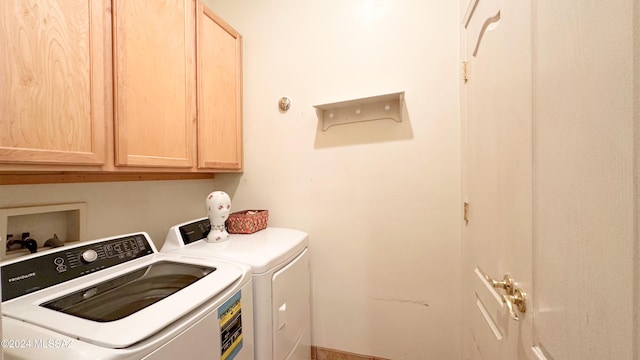 laundry area with cabinets and washing machine and dryer