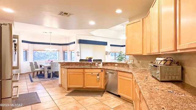 kitchen with dishwasher, light brown cabinets, and kitchen peninsula