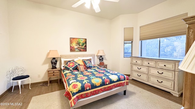 bedroom with ceiling fan and wood-type flooring