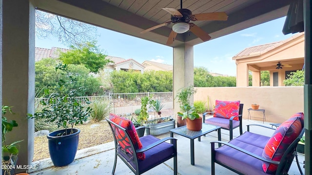 view of patio with outdoor lounge area and ceiling fan