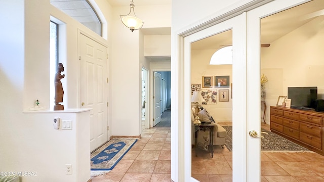 tiled entryway with french doors