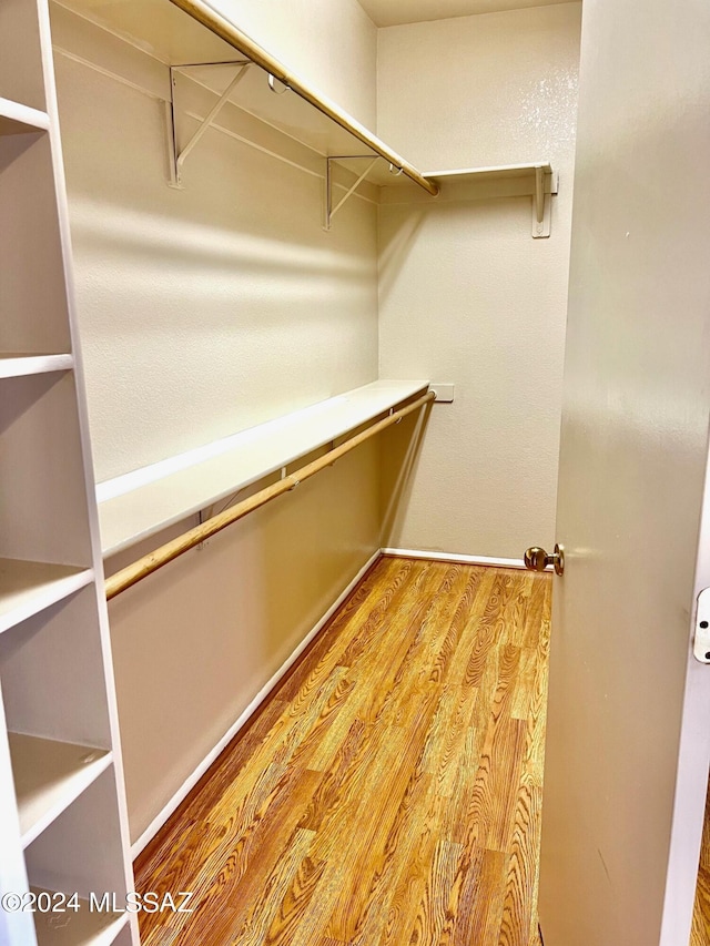 walk in closet featuring hardwood / wood-style floors