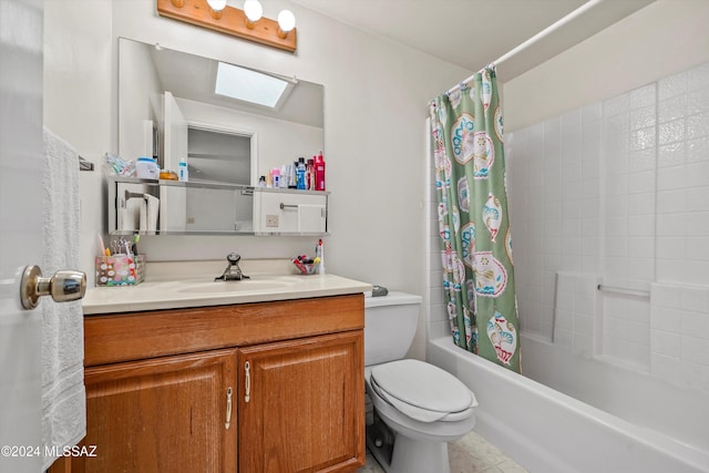 full bathroom with a skylight, tile patterned flooring, toilet, shower / tub combo with curtain, and vanity