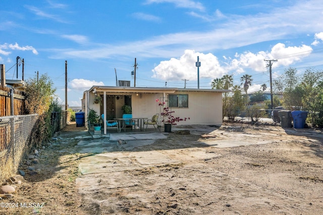 rear view of property featuring a patio area