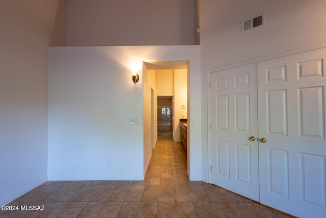 corridor with light tile patterned floors