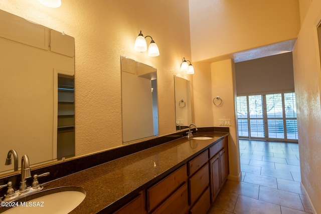 bathroom featuring tile patterned flooring and vanity