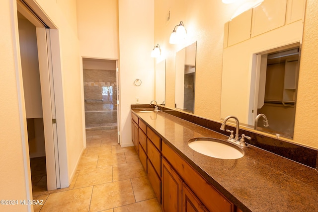 bathroom featuring tile patterned flooring and vanity