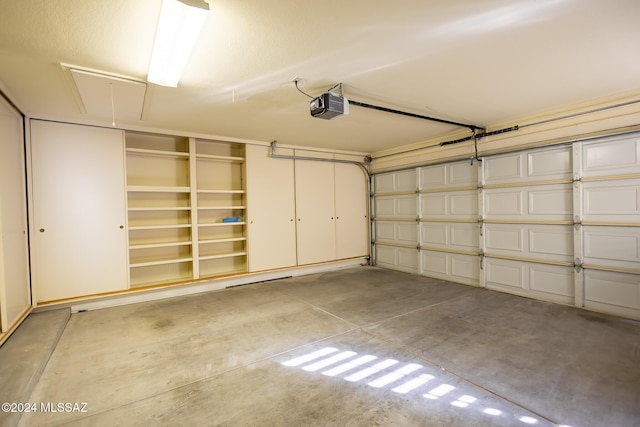 garage featuring a garage door opener