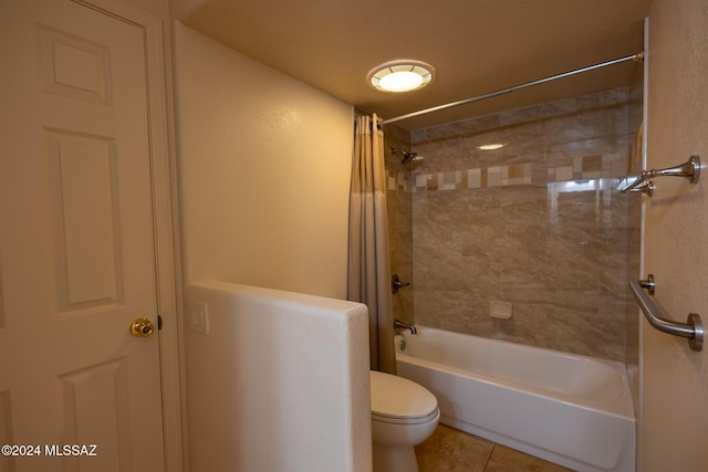 bathroom with tile patterned floors, shower / bathtub combination with curtain, and toilet