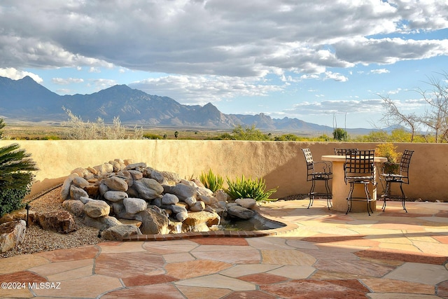 view of patio / terrace with a mountain view