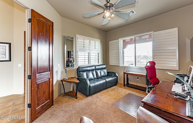 office space with ceiling fan and light colored carpet