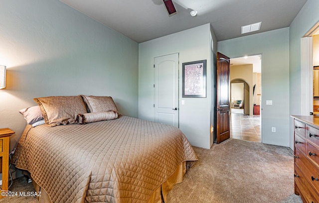 carpeted bedroom with ceiling fan