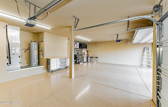 garage featuring electric water heater and a garage door opener