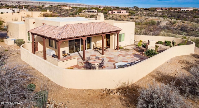 rear view of house with a patio area