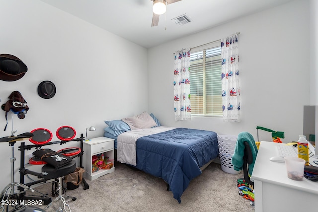 bedroom with ceiling fan, visible vents, and light colored carpet