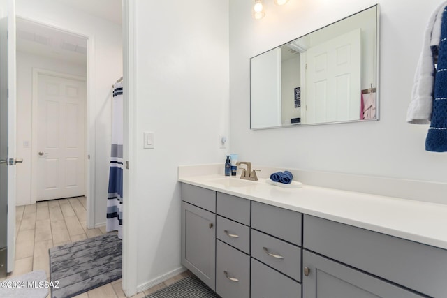 bathroom featuring wood finish floors and vanity