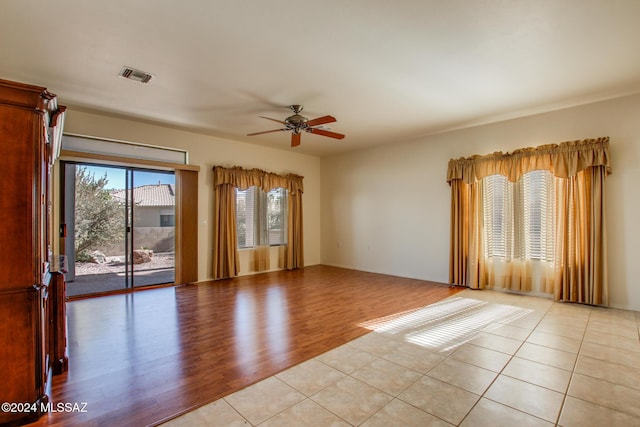 unfurnished room featuring ceiling fan and light hardwood / wood-style flooring