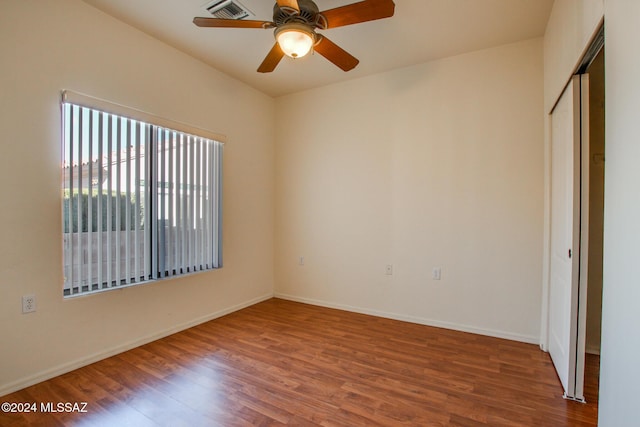 spare room featuring ceiling fan and wood-type flooring