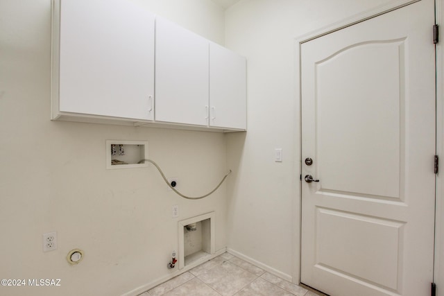 laundry room featuring cabinets, washer hookup, hookup for an electric dryer, hookup for a gas dryer, and light tile patterned floors